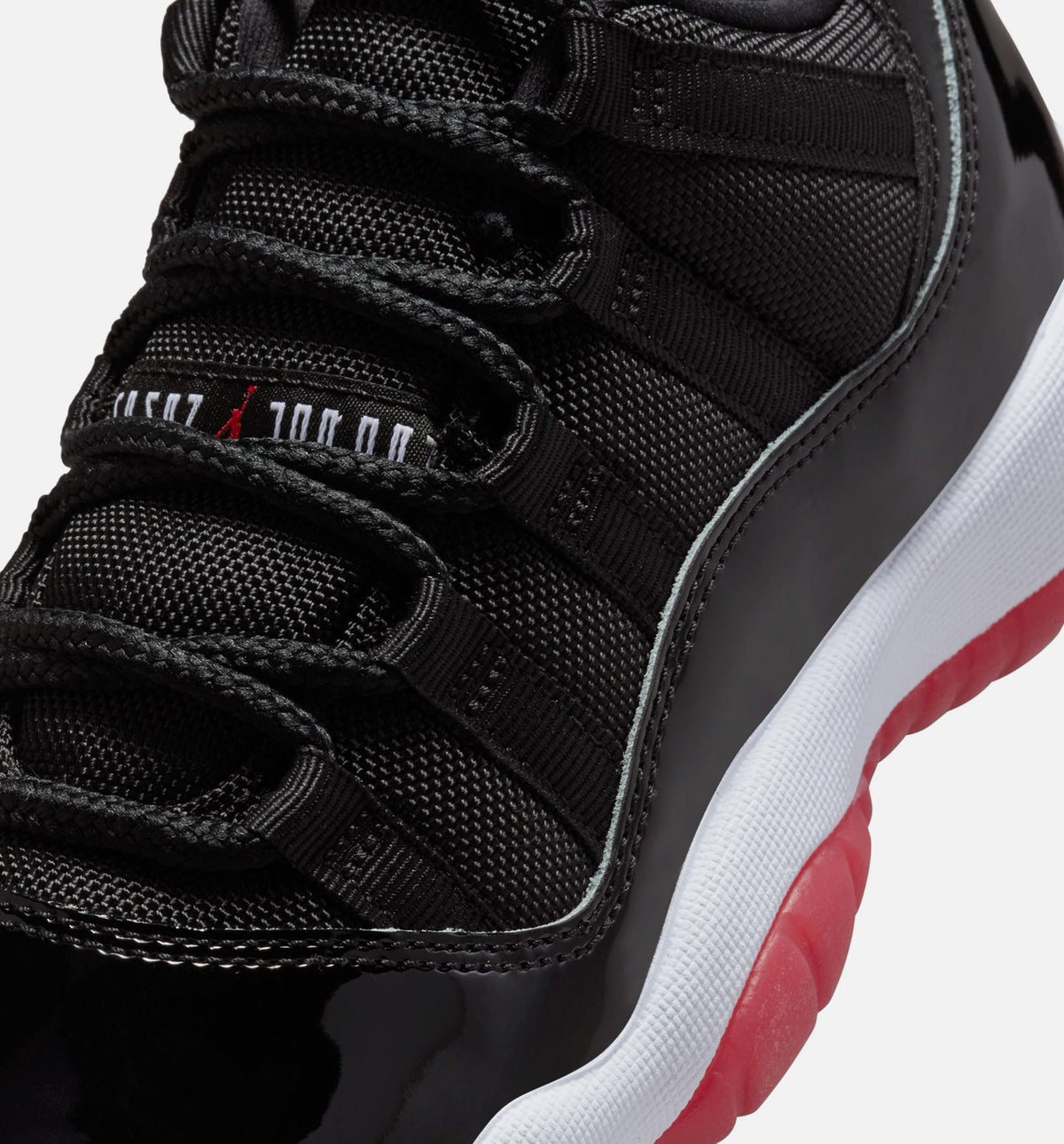 Air Jordan 11 Retro Bred – Grade School Lifestyle Shoe (Black/Varsity Red/White)